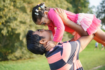 Father playing with daughter