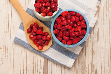 Fresh strawberries on vintage wooden board, organic food concept