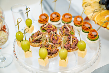 canapes. A convenient buffet feed. little sandwiches at the festival. Catering. delivery of ready meals and service of banquets.