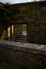 Stairs, door and wall of a ruined building