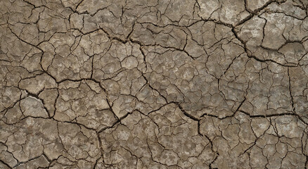 Cracked soil ground into the dry season, Broken clay pattern, Texture background