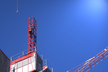 Engineers are installing elevators system, Passenger lift used for worker and moving materials,...