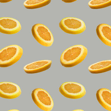 Seamless pattern of sliced flying orange lemon on gray background. Cut orange lemont in pieces. Levity fruit floating in the air. Flying food concept. Applicable for fruit juice advertising
