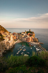 Vernazza - One of five cities in Cinque Terre, Italy. Colorful houses stacked upon each other along a cliffside in Italy.
