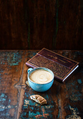Cappuccino and Cantuccini (Italian cookie) on dark wooden background. Copy space.