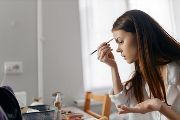 face makeup woman with eyeliner indoors model