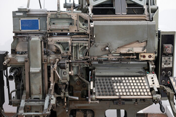Old machine of a printing press, it is a printing machine - obrazy, fototapety, plakaty