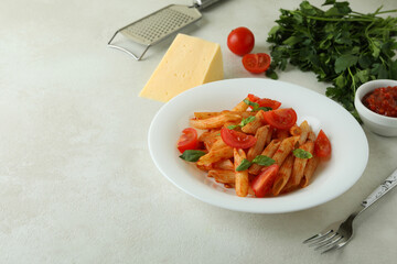 Concept of tasty food with pasta with tomato sauce and ingredients