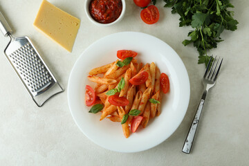 Concept of tasty food with pasta with tomato sauce and ingredients