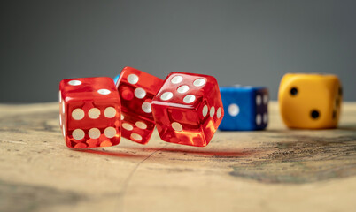 Colorful dices on the map. Concept of board games and a lucky chance to win