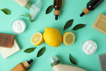 Fototapeta na wymiar Cleaning concept with eco friendly cleaning tools and lemons on mint background