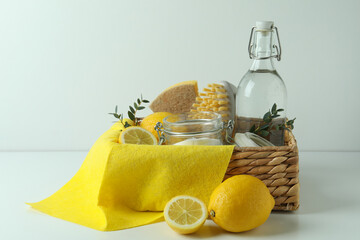 Cleaning concept with eco friendly cleaning tools and lemons on white background