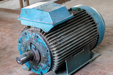 Industry. A damaged high-power electric motor without a belt pulley.