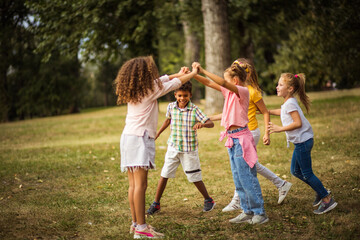 Fototapeta premium Happy kids playing in the park.