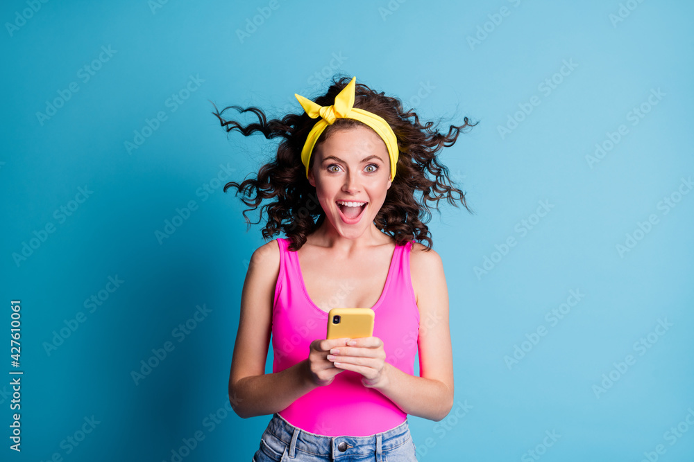 Sticker photo of shiny impressed young lady wear pink singlet typing modern gadget open mouth isolated blue 