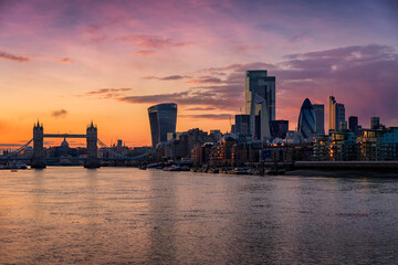 The skyline of the City of London, United Kingdom, with Tower Bridge and Thames river during dusk