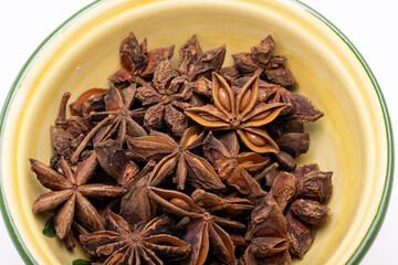 Star anise in a vintage ceramic bowl