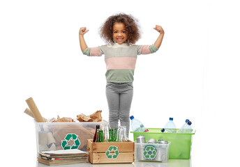 recycling, waste sorting and sustainability concept - smiling african american girl with with plastic and glass bottles, papers garbage and metal tin cans in boxes over white background