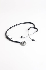 Black stethoscope on white background