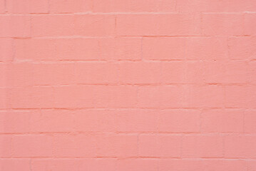 Texture of brick wall. Samples of wall or fence are presented at exhibitions. Pink brick close up.