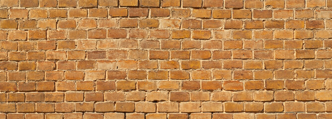 Texture of brick wall. Samples of wall or fence are presented at exhibitions. Orange brick close up.