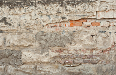 Plaster on a yellow wall. Concrete wall texture close up.