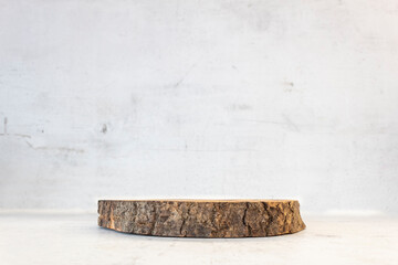 Wooden empty podium (stage) on concrete (cement) background. Empty showcase.