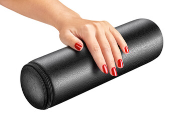 Female hand, fingers with beautiful bright red varnish on a black manicure pillow. Isolated over white background. Close-up. Side view.