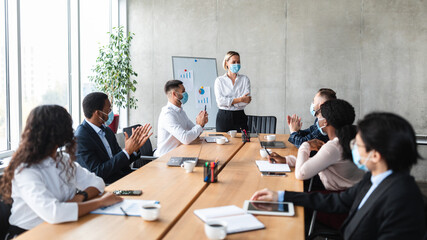 Business People Applauding Approving Successful Presentation In Office During Meeting