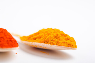 turmeric and chilly powder in spoon
