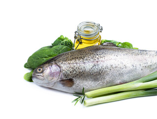 Fresh rainbow trout with herbs and olive oil isolated on white