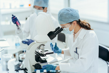 laboratory technician conducts testing in the laboratory .