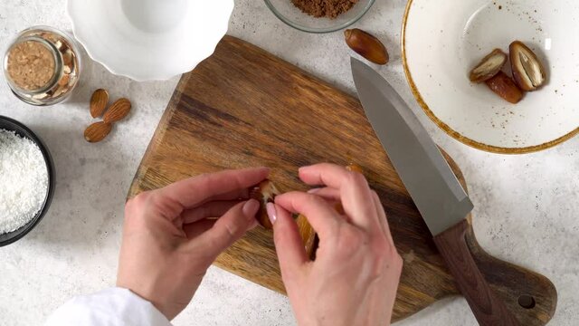 Step by step cooking Energy balls. Step1 peeling dates from the seeds with knife
