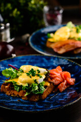 Fresh sandwich with egg poached, red fish on rye bread. Keto-balanced diet food. Healthy and nutritious food