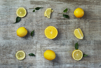 Fresh lemons on wood background. Copy space. Top view.