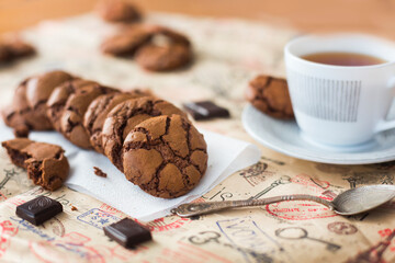 Homemade chocolate cookies brookies, dark chocolate slices and a cup of tea 
