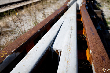 New railway junction lines ready to place. Railway rails painted white. Close up
