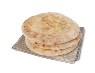 Arabic bread, three pieces resting on a tablecloth, isolated on white background