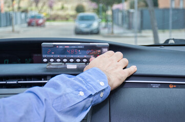 Cab driver using his cab meter to start a service.Selective focus