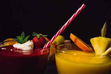 strawberry red and mango pineapple fruit shake frappe served and decorated  