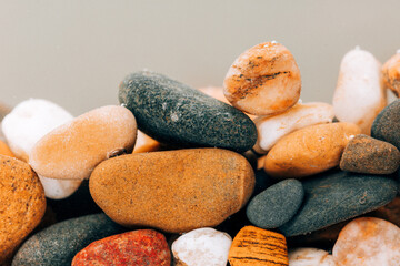 Colorful sea pebbles close-up. Background texture, sea stones in the water