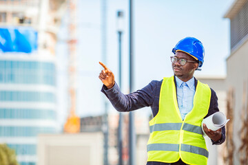 Portrait of satisfied and confident engineer with helmet and news on building site. Close-up portrait of professional architect in hard hat looking away