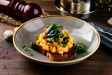 Breakfast omelette with champignon on wooden background