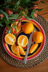 Still-life. Sliced orange on a plate.