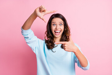 Photo of young excited woman happy positive smile show fingers frame sign make photo isolated over pastel color background