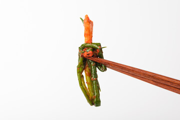 Green onion kimchi on white background