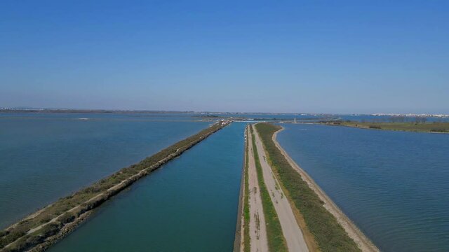 Aerial panoramic view of the Mediterranean coast and canal in between Sète and Palavas in Occitanie France