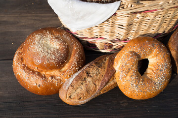 Bread and buns on a brown table on a picnic