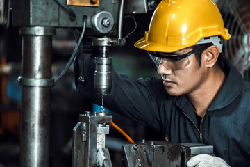 engineer mechanic man working metal machine at factory, worker at industrial working concept	