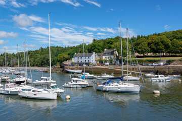Fototapeta na wymiar Boats in the scenic port of Rosbras on Aven river in Finistère, Brittany, France
